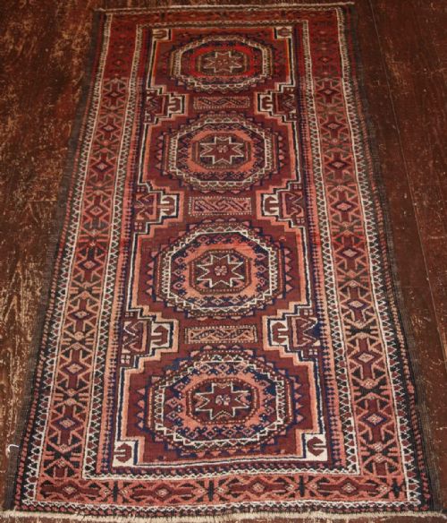 Antique Baluch Rug with Star & Gul Design, Afghanistan Circa 1900.