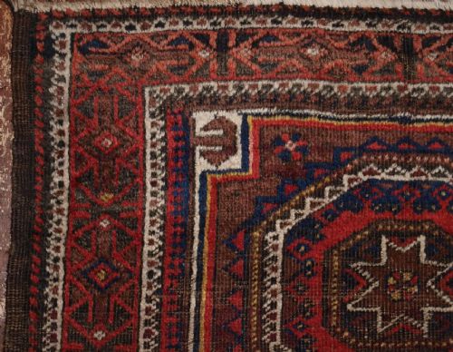 fig 1. ANTIQUE BALUCH RUG WITH STAR & GUL DESIGN, AFGHANISTAN CIRCA 1900.