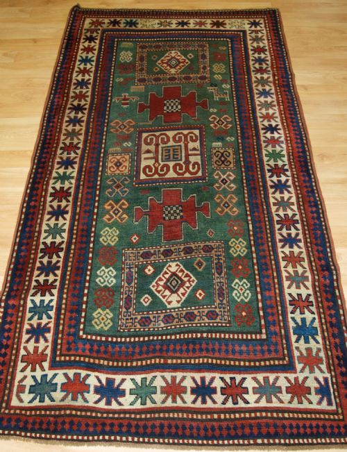 Antique Caucasian Karachov Kazak of Rare Green Ground Format, 4th Quarter 19th Century.