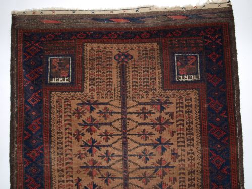 fig 1. ANTIQUE BALUCH CAMEL GROUND PRAYER RUG WITH 'TREE OF LIFE' DATED TO THE HAND PANELS, CIRCA 1900.