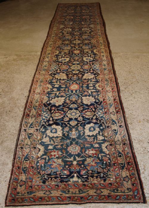 Antique Kurdish Runner, Floral Design on a Blue Ground, Circa 1900.