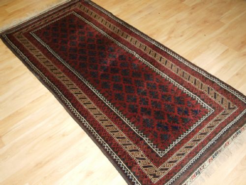 Antique Baluch Rug with Lattice Design, Camel Border, Kilim Ends, Circa 1900.