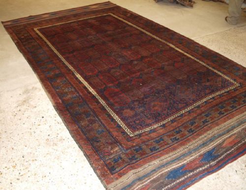 Antique Western Afghan Baluch Carpet, Shrub Design, Long Kilim Ends, Circa 1870.