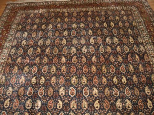 fig 1. OLD TURKISH HEREKE CARPET OF ALL OVER BOTEH DESIGN, SIGNED 'HEREKE', CIRCA 1920/30.