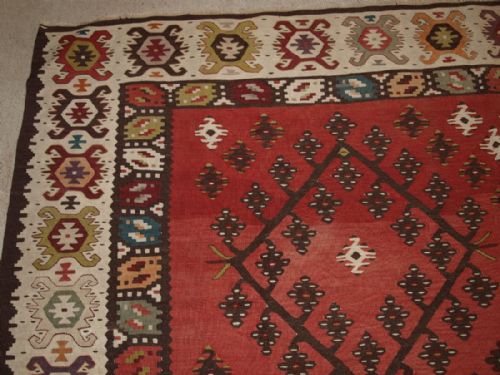 fig 1. OLD TURKISH SARKOY KILIM RUG, TRADITIONAL DESIGN ON SOFT RED GROUND, CIRCA 1920.