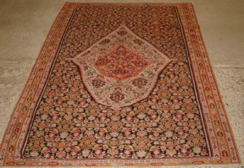 Antique Persian Senneh Kilim, Unusual Medallion Design on a Heratti Field, Circa 1900.