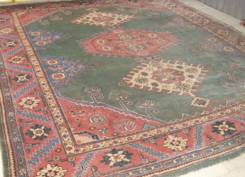 Antique Turkish Oushak Carpet, Unusual Green Field with Caucasian Design, Circa 1900/20.
