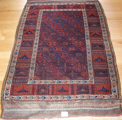 Very Rare Antique Baluch Rug with Calyx Lattice Field and Yomut Turkmen Borders, 2nd Half 19th Century.