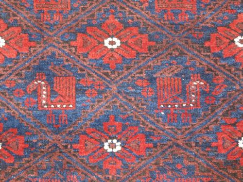 fig 1. ANTIQUE 'BIRD' BALUCH RUG, LATTICE DESIGN WITH BIRDS, SUPERB COLOURS, CIRCA 1890.