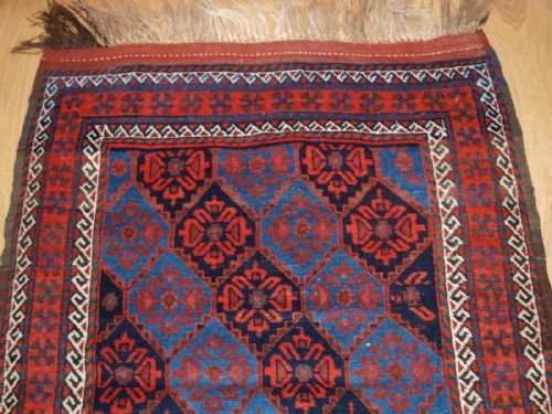 fig 1. ANTIQUE KORDI RUG WITH LATTICE DESIGN AND SUPERB COLOUR, CIRCA 1900.