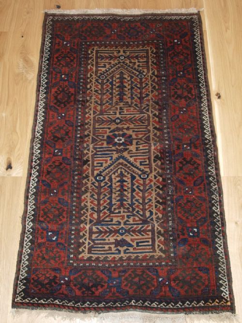 Antique Baluch Rug with Camel Ground and Unusual Design, Old Repairs, Late 19th Century.