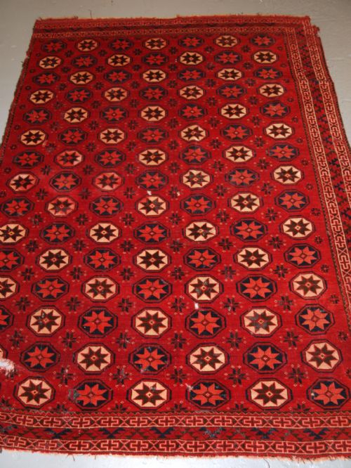 fig 1. ANTIQUE ERSARI TURKMEN MAIN CARPET FRAGMENT, UNUSUAL STAR DESIGN, 2ND HALF 19TH CENTURY.
