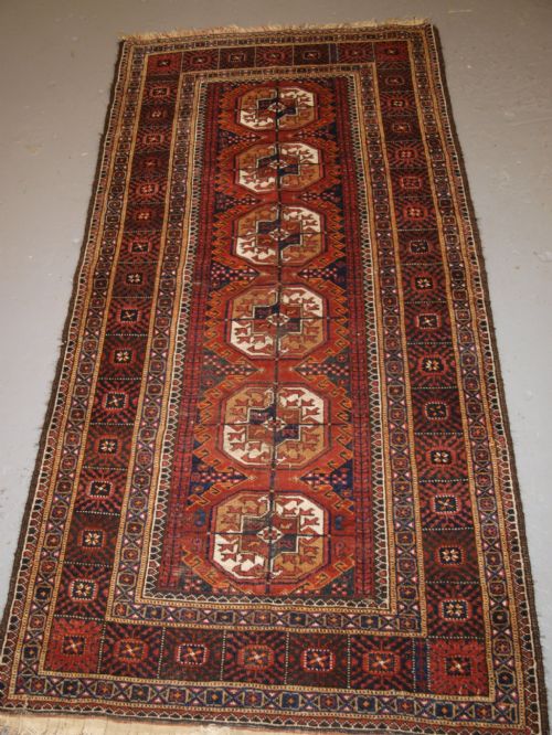 Antique Baluch Rug by the Mahdad Khani Tribe, Large Tekke Guls, Circa 1900.