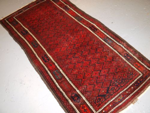 fig 1. ANTIQUE BALUCH RUG WITH FINE DIAMOND LATTICE DESIGN, INTERESTING BORDER, CIRCA 1900.