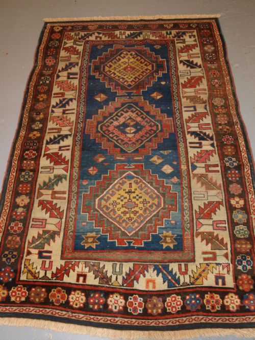 Antique Caucasian Kazak Three Medallion Rug with Superb Soft Colours, Circa 1900.