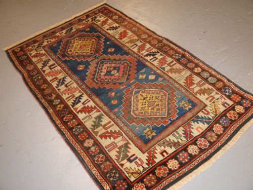 fig 1. ANTIQUE CAUCASIAN KAZAK THREE MEDALLION RUG WITH SUPERB SOFT COLOURS, CIRCA 1900.
