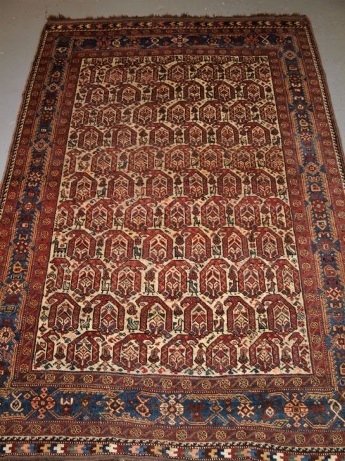 Antique Rug by the Khamseh Tribe, All Over Boteh Design on an Ivory Field, Circa 1900.
