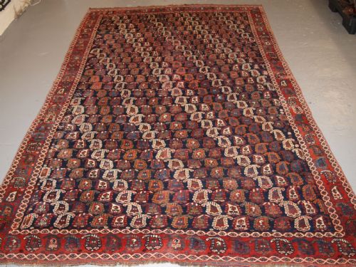fig 1. ANTIQUE PERSIAN RUG BY THE KHAMSEH TRIBE WITH ALL OVER BOTEH DESIGN, LATE 19TH CENTURY.