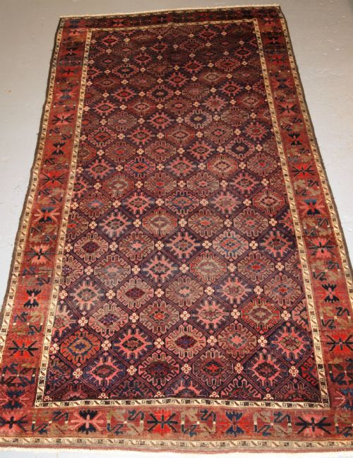 fig 1. ANTIQUE BALUCH RUG WITH SNOW FLAKE LATTICE DESIGN, WESTERN AFGHANISTAN, LATE 19TH CENTURY.