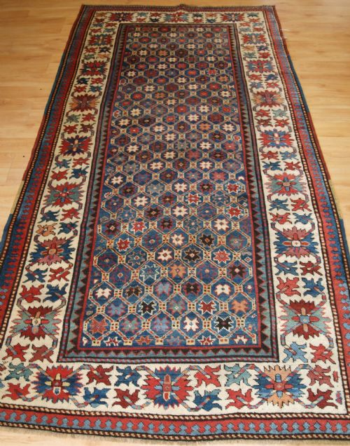 Antique Caucasian Gendje Kazak Rug, Lattice and Star Design, Circa 1880.