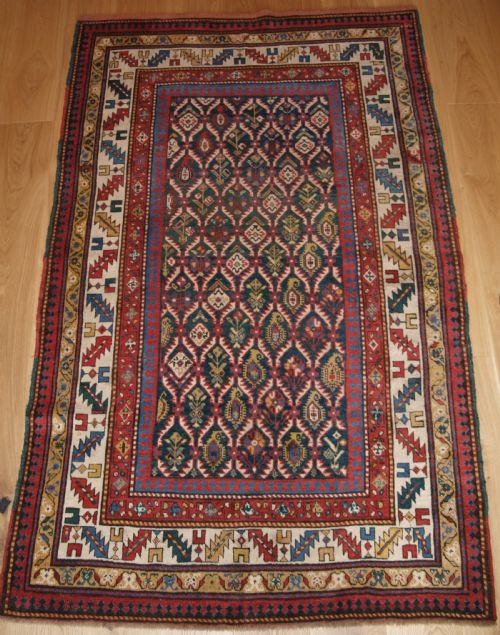 Antique Caucasian Daghestan Rug with Scarce Green Ground, Lattice Design, Circa 1880.