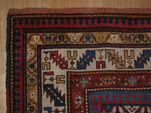 fig 1. ANTIQUE CAUCASIAN DAGHESTAN RUG WITH SCARCE GREEN GROUND, LATTICE DESIGN, CIRCA 1880.