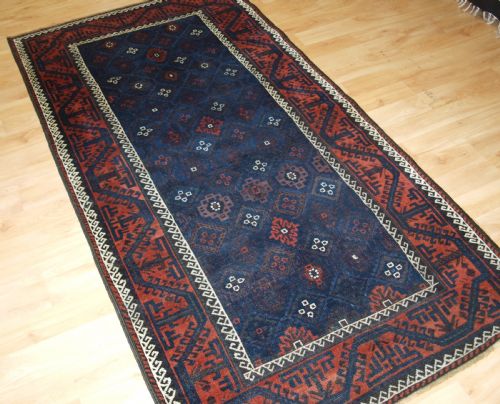 fig 1. ANTIQUE BALUCH RUG WITH LATTICE DESIGN IN SUPERB BLUES, BOAT BORDER, LATE 19TH CENTURY.