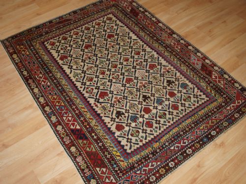 fig 1. ANTIQUE CAUCASIAN DAGHESTAN RUG WITH IVORY GROUND FLORAL LATTICE, SUPERB, CIRCA 1880.