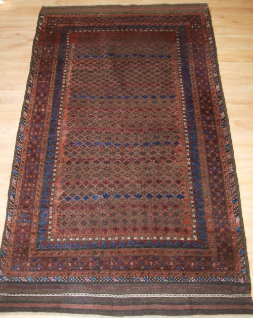 Antique Baluch Rug with Repeat Design, Complete Kilim Ends, Circa 1900.
