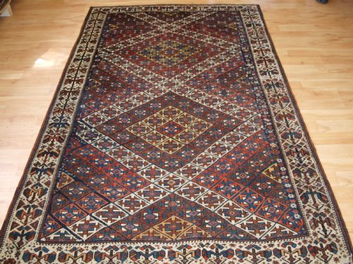 Antique Kurdish Rug with Lattice Design, Visually Striking Rug, Circa 1900.