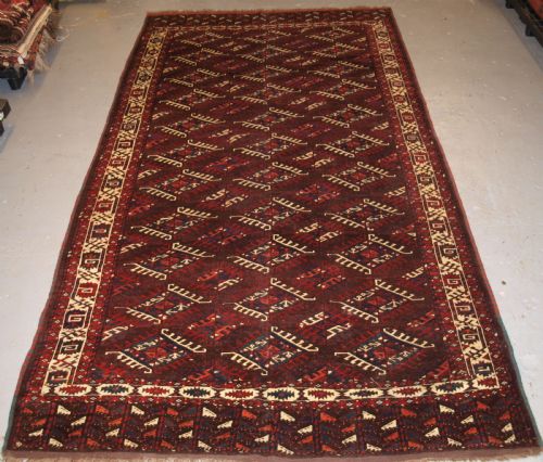 Antique Yomut Turkmen Main Carpet with Dyrnak Gul Design, Curl Leaf Border, Circa 1880.