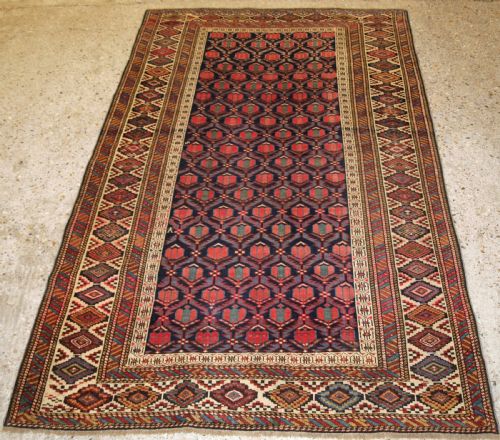 Antique Caucasian Shirvan Rug with Lattice Design Filled with Tulips, Late 19th Century.
