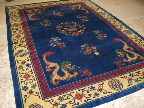 Antique Chinese Peking Carpet with Four Dragons, Circa 1920.