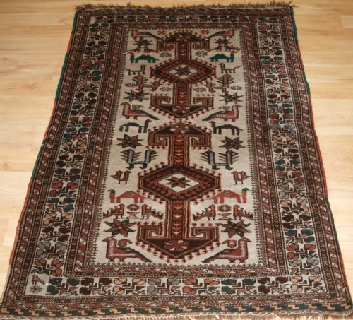 Old Kurdish Village Rug, Hooked Medallions with Animals, Circa 1920.