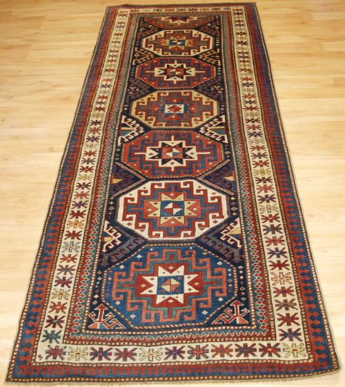 Antique Caucasian Moghan Kazak Runner with Memling Gul Design, Circa 1880.