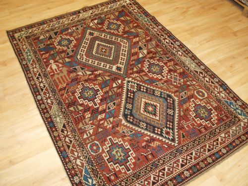 fig 1. ANTIQUE CAUCASIAN DAGHESTAN RUG, CAMEL, PEOPLE AND ANIMALS, CIRCA 1890