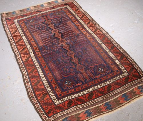 fig 1. ANTIQUE TIMURI BALUCH RUG WITH BLUE GROUND AND TREE OF LIFE, CIRCA 1880.