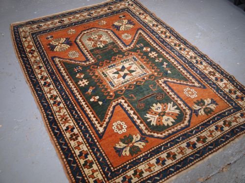 fig 1. ANTIQUE CAUCASIAN SEWAN KAZAK RUG WITH GREEN GROUND MEDALLION, CIRCA 1890.