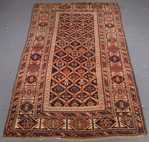 Antique Caucasian Dagestan Rug, Lattice Design with Human Figures, Circa 1880.