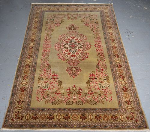 Antique Turkish Hereke Wool Rug with Scarce Green Ground, Circa 1900/20.