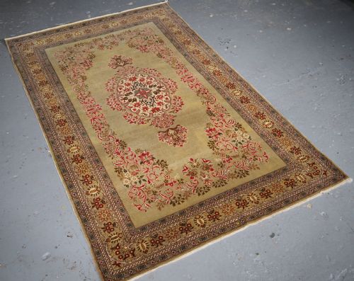 fig 1. ANTIQUE TURKISH HEREKE WOOL RUG WITH SCARCE GREEN GROUND, CIRCA 1900/20.