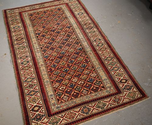 fig 1. ANTIQUE CAUCASIAN KUBA SHIRVAN RUG OF FLORAL LATTICE DESIGN, CIRCA 1880.