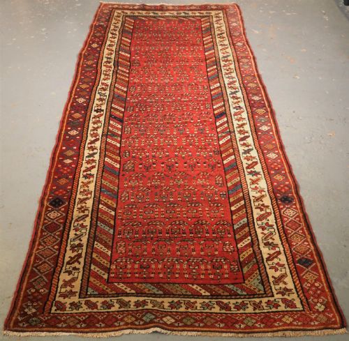 Antique Kurdish Long Rug with All Over Boteh Design, Circa 1900.