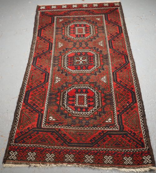 Antique Salar Khani Baluch Rug, Turreted Gul Design, Circa 1900.
