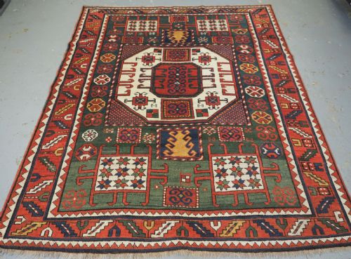 Antique Caucasian Karachov Kazak Rug with Green Ground, Circa 1890.
