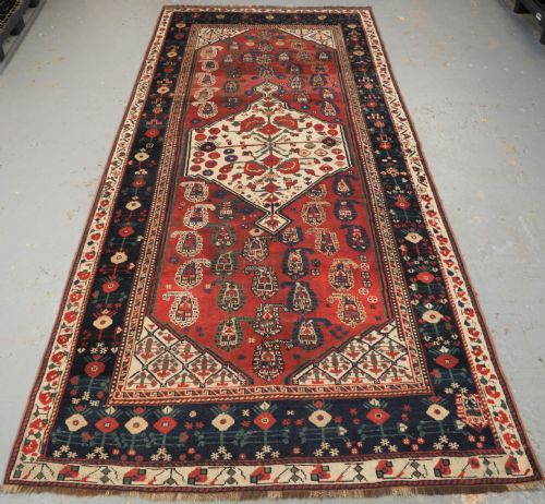 Antique Tribal Khamseh Rug with Boteh and Pomegranate Design, Circa 1860.