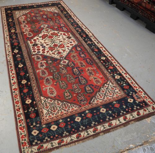 fig 1. ANTIQUE TRIBAL KHAMSEH RUG WITH BOTEH AND POMEGRANATE DESIGN, CIRCA 1860.