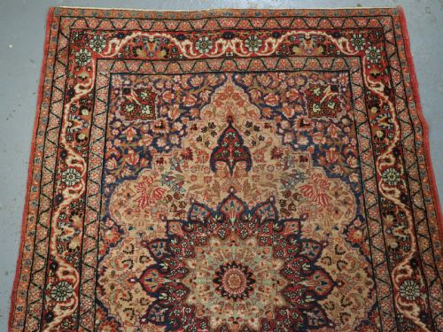 fig 1. ANTIQUE KIRMAN RUG WITH MEDALLION AND SOFT COLOURS, CIRCA 1900.