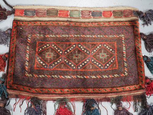 fig 1. ANTIQUE AFGHAN TRIBAL STORAGE BAG COMPLETE WITH TASSELS, CIRCA 1920.