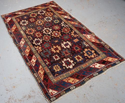 fig 1. ANTIQUE CAUCASIAN DAGESTAN RUG WITH BLOSSOM DESIGN, CIRCA 1880.